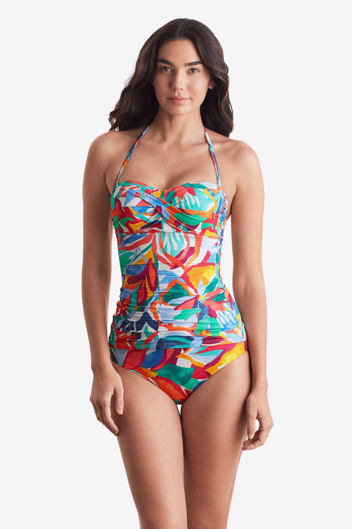 Woman wearing a multicolored floral bandeau tankini top with matching swim bottoms
