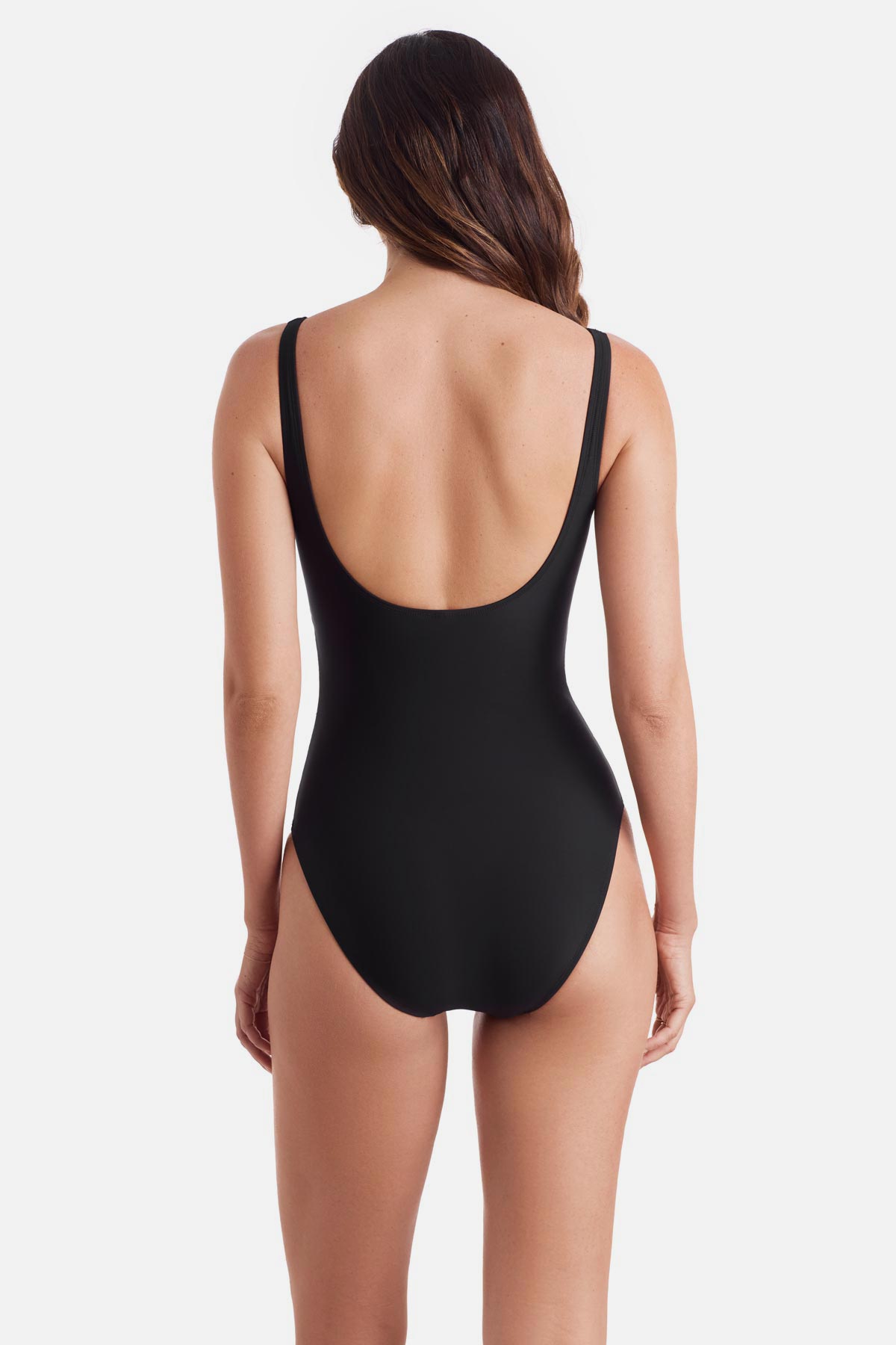 Woman turned away wearing a black one-piece swimsuit with a v neckline