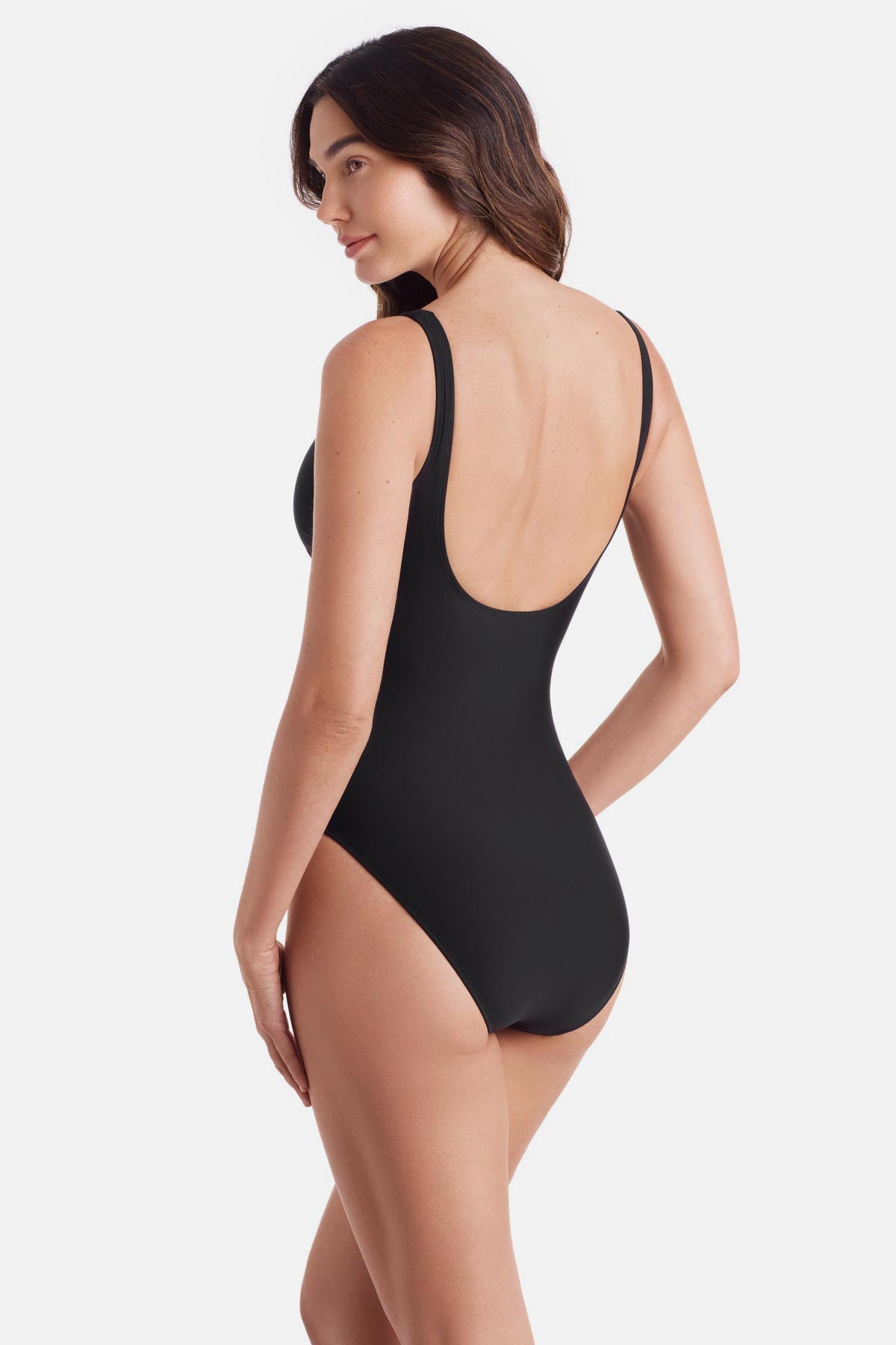 Woman turned left wearing a black one-piece swimsuit with a v neckline