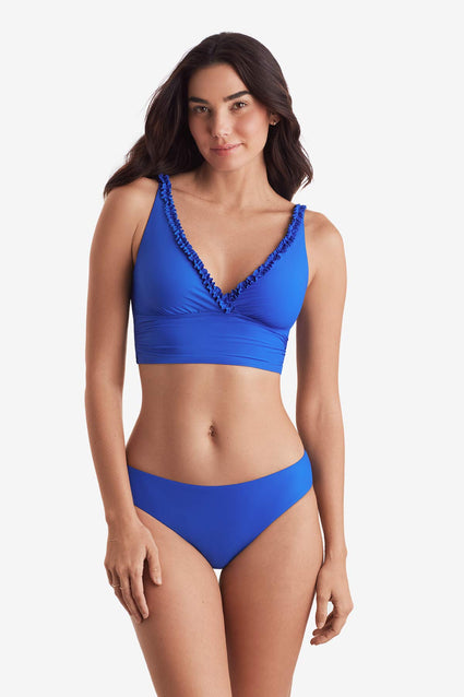 Woman wearing a midkini swim top with matching swim bottoms