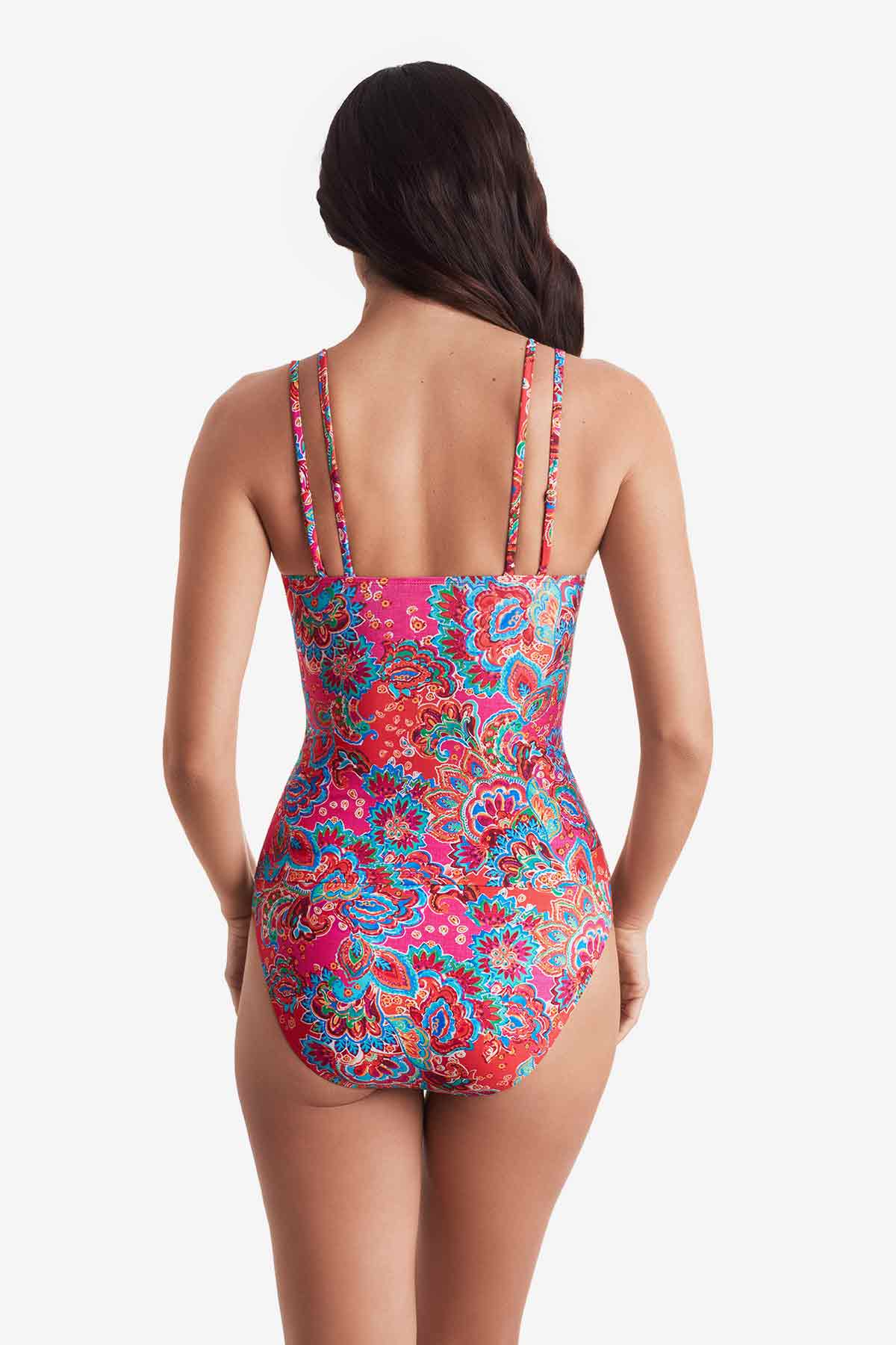 Woman turned away wearing a multicolor paisley print tankini top with matching swim bottoms