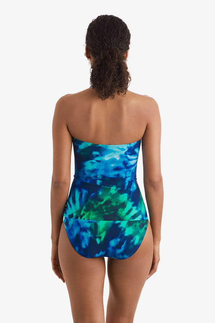 Women faced away wearing a blue and green tie dye bandeau tankini top