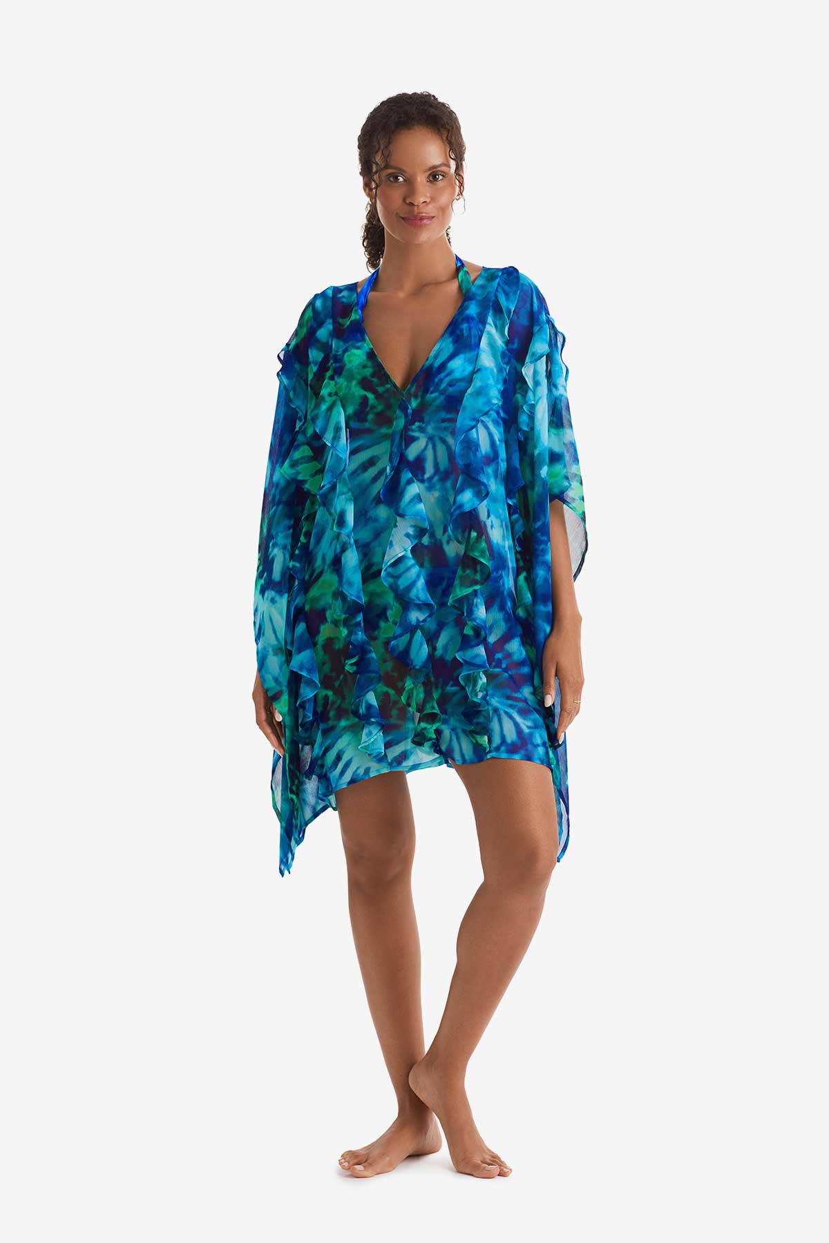 Woman wearing a blue and green tie dye swim poncho cover up