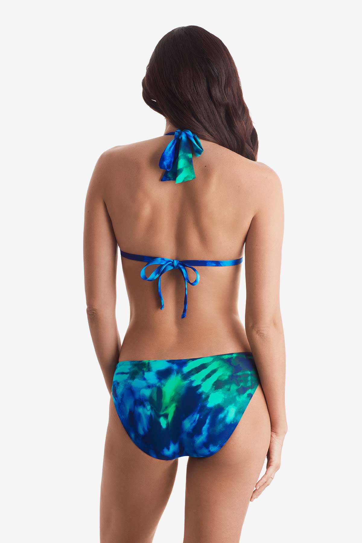 Woman turned away wearing a blue and green tie dye bikini top with matching swim bottoms