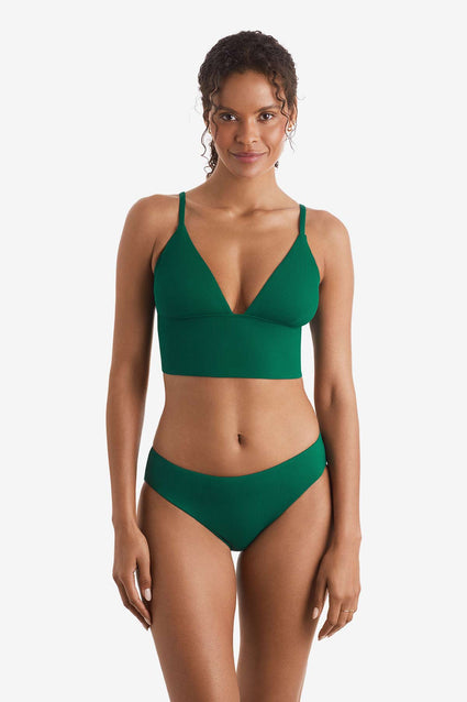 Woman wearing a green rib fabric midkini swim top with green rib fabric swim bottoms