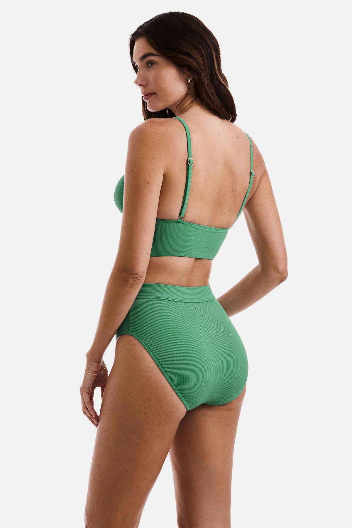 Woman turned left wearing a green ribbed midkini bralette swim top with matching swim bottoms