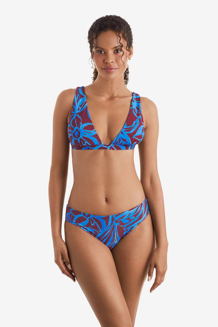 Woman wearing a blue and brown abstract printed bikini top with match swim bottoms