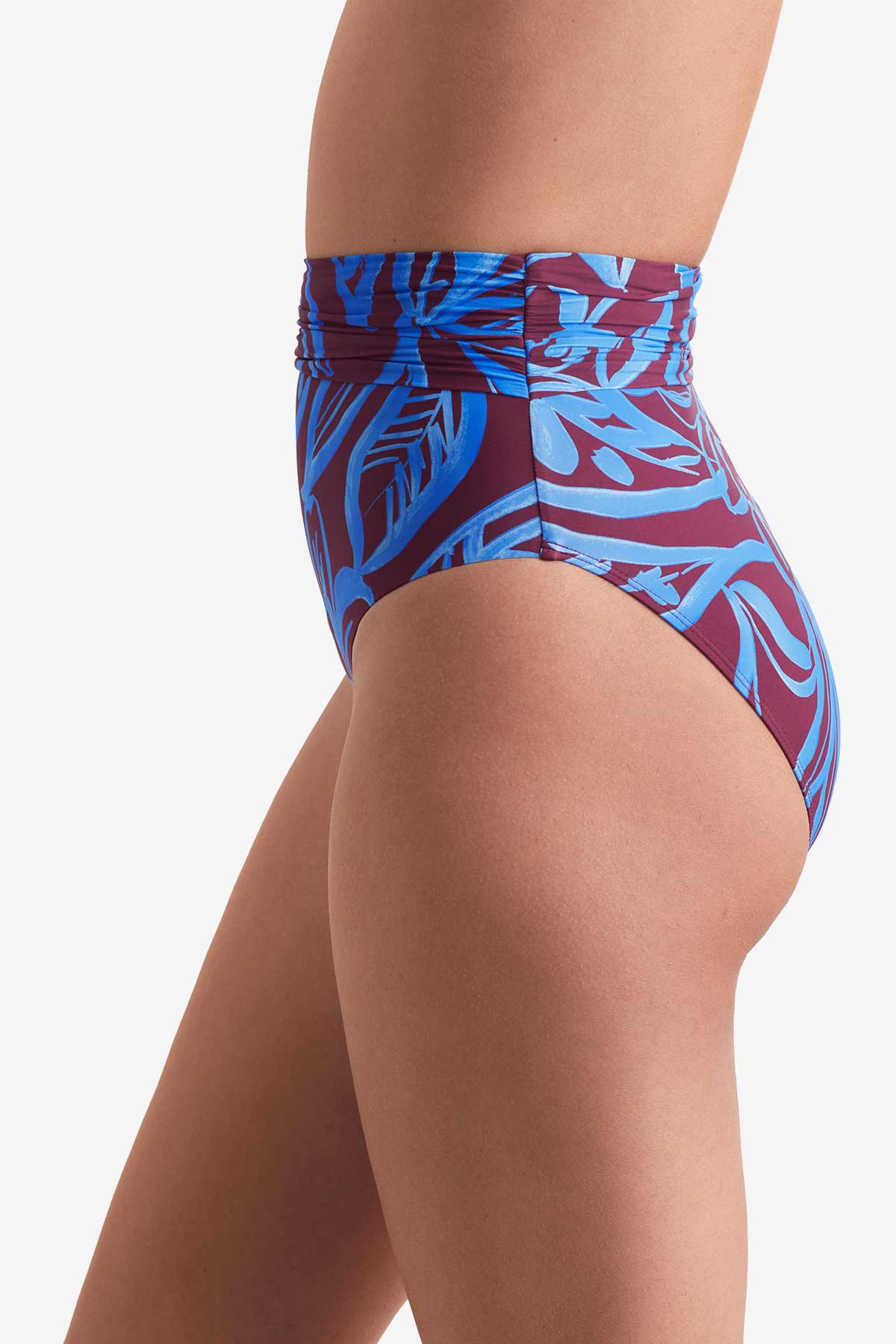 Side of high waisted blue and brown abstract floral printed swim bottoms