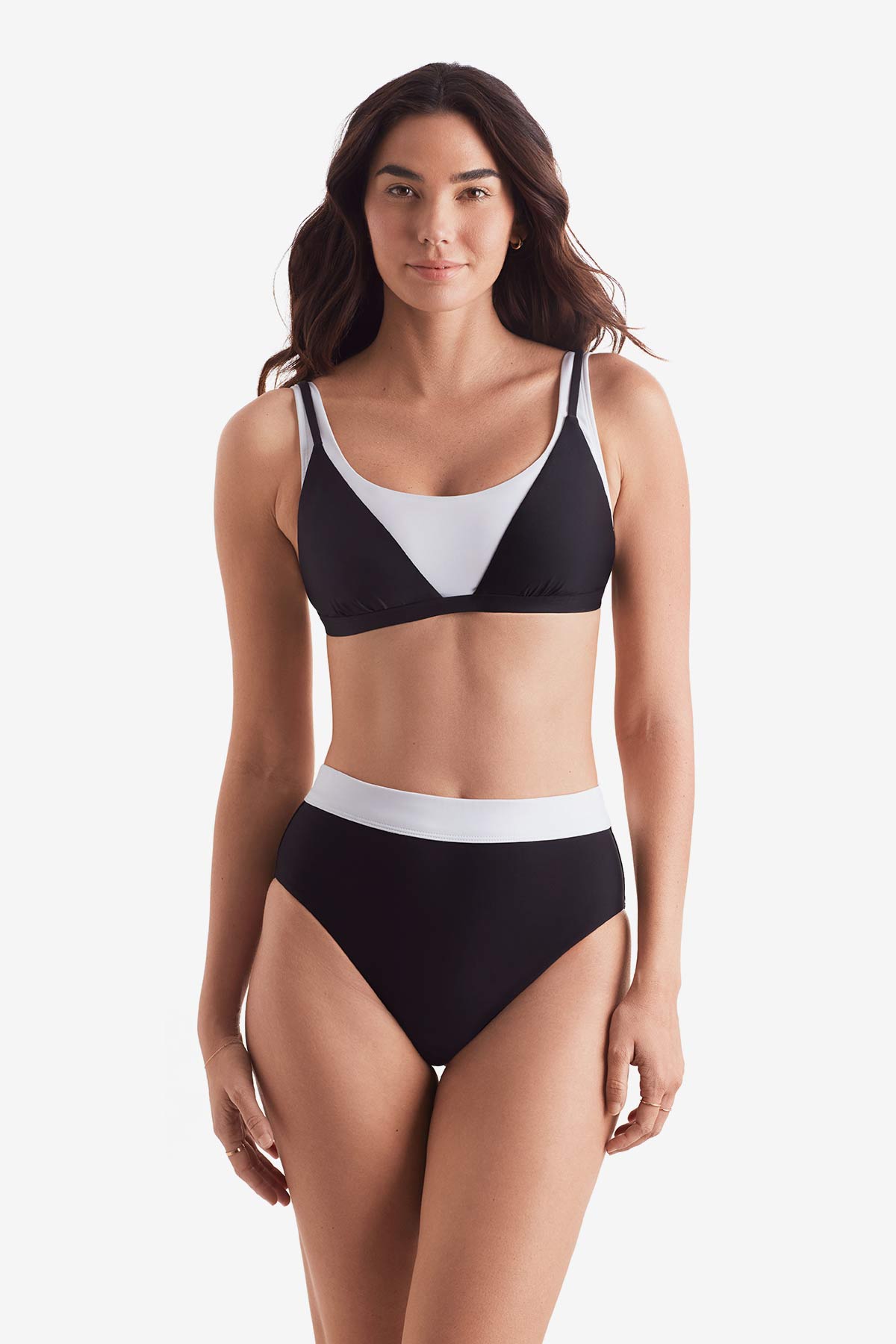 Women wearing a black and white bikini top and black and white swim bottoms