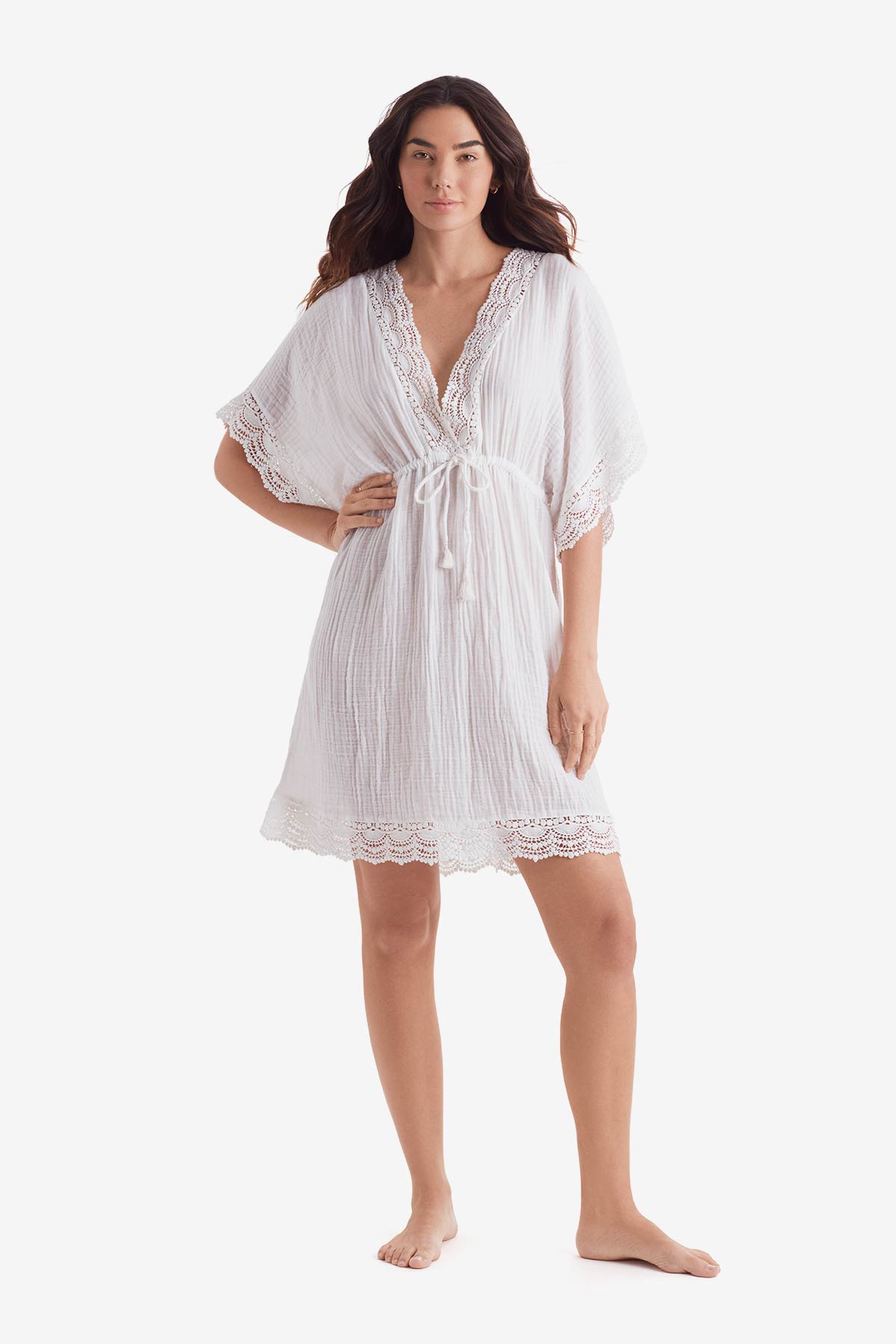 Woman wearing a white tunic dress