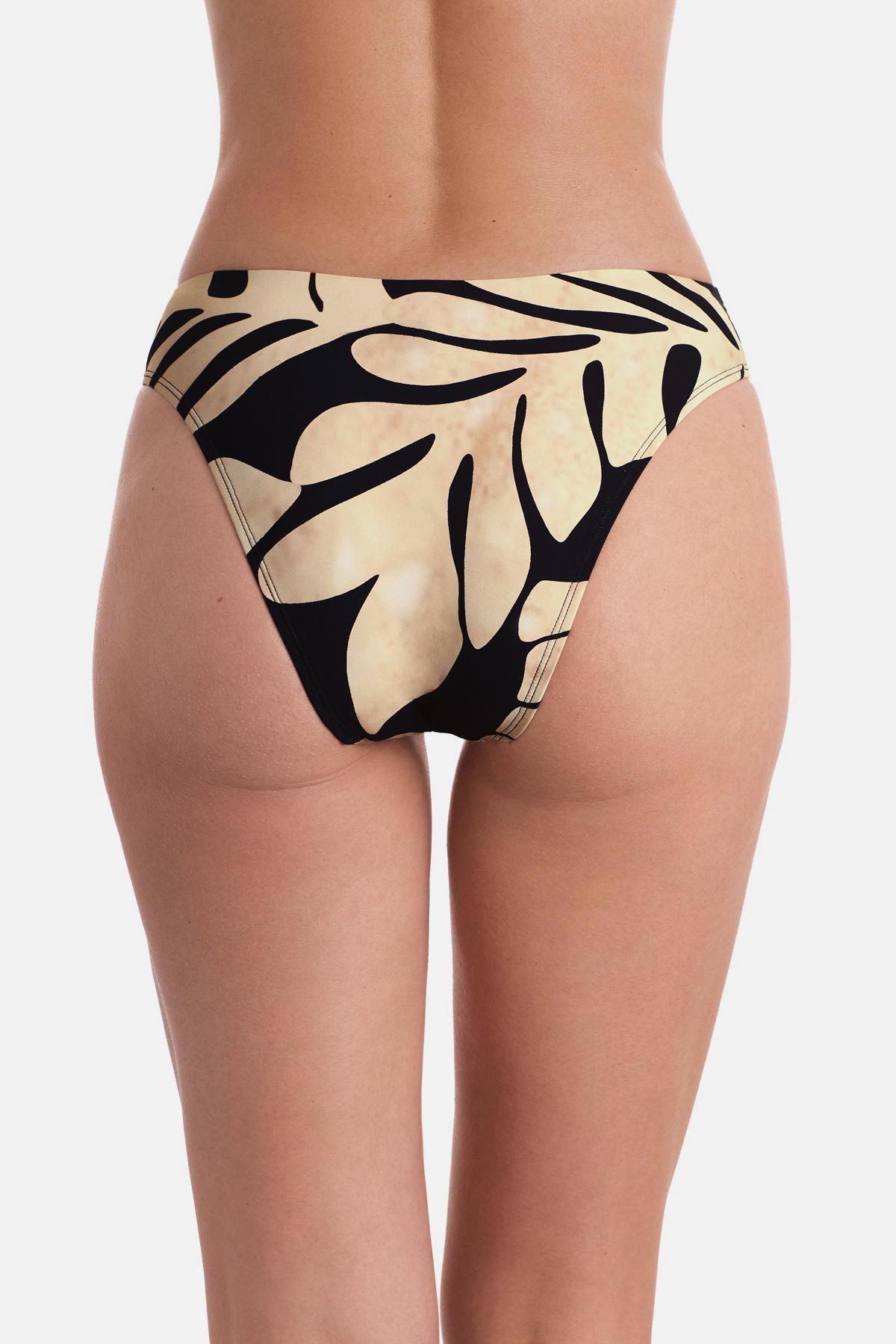 Back view of large tan and black palm leaf printed low rise swim bottoms