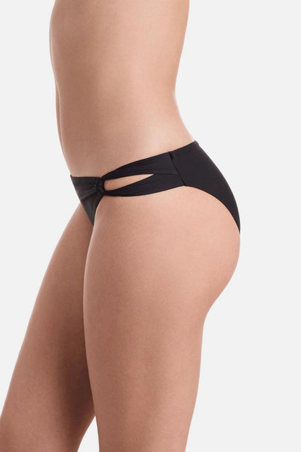 Side view of side cut out black swim bottoms