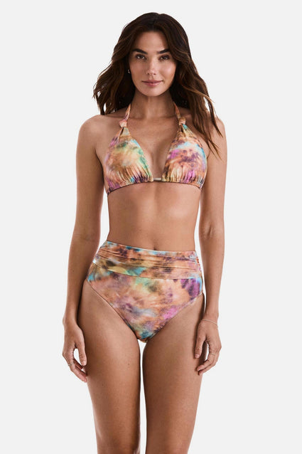 Woman wearing a tie dye bikini top with matching swim bottoms