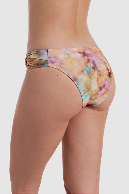 Back view of tie dye swim bottoms with side cutouts
