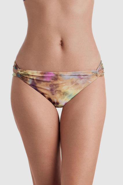 Front view of tie dye swim bottoms with side cutouts
