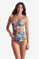 Woman wearing a multicolored floral bandeau tankini top with matching swim bottoms