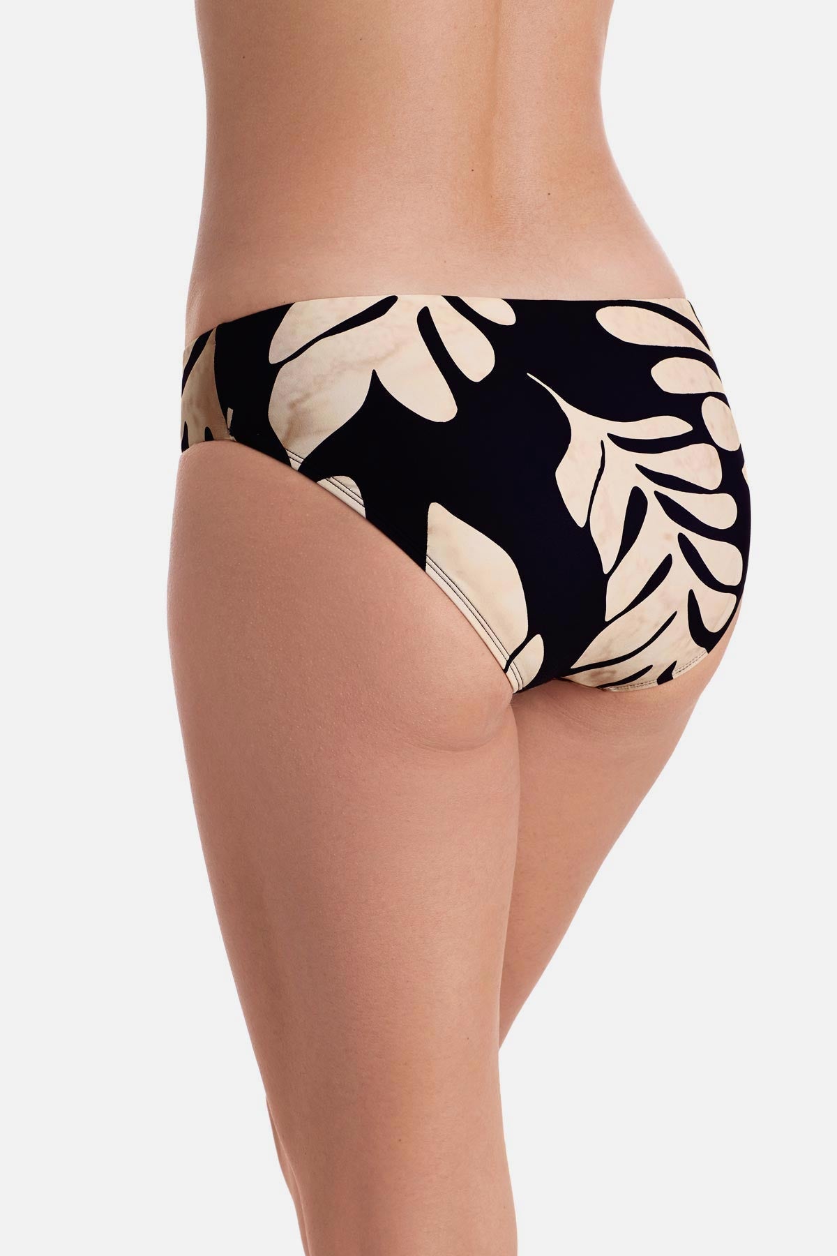 Back of large black and tan palm leaf printed swim bottoms