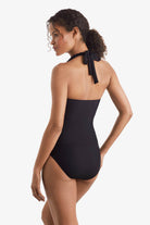 Woman turned left wearing a black tankini top 