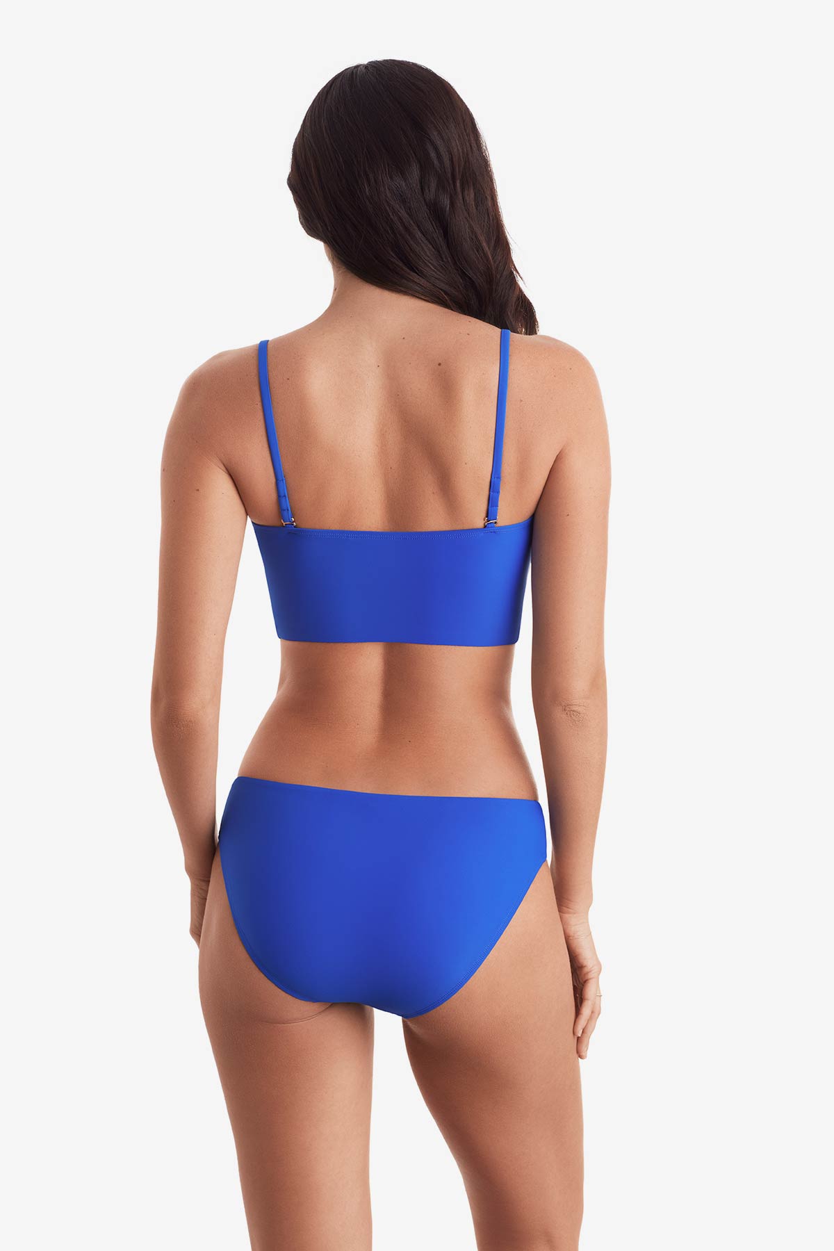 Woman turned away wearing a midkini swim top with matching swim bottoms