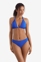 Woman wearing a blue bikini top with matching swim bottoms