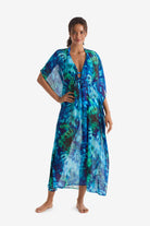 Woman wearing a blue and green tie dye caftan swim dress cover up