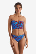 Woman wearing a blue and brown abstract floral printed midkini swim top with matching swim bottoms