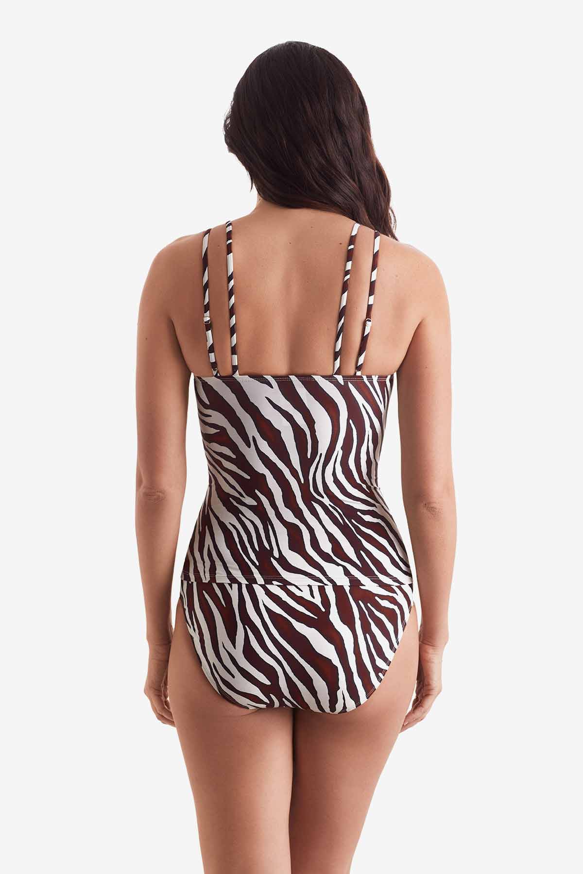 Woman turned away wearing a zebra print tankini top