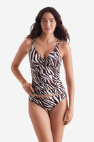 Woman wearing a zebra print tankini top