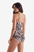 Woman turned left wearing a zebra print tankini top