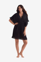 Woman wearing a black tunic dress