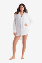 Woman wearing a white long sleeve button up shirt