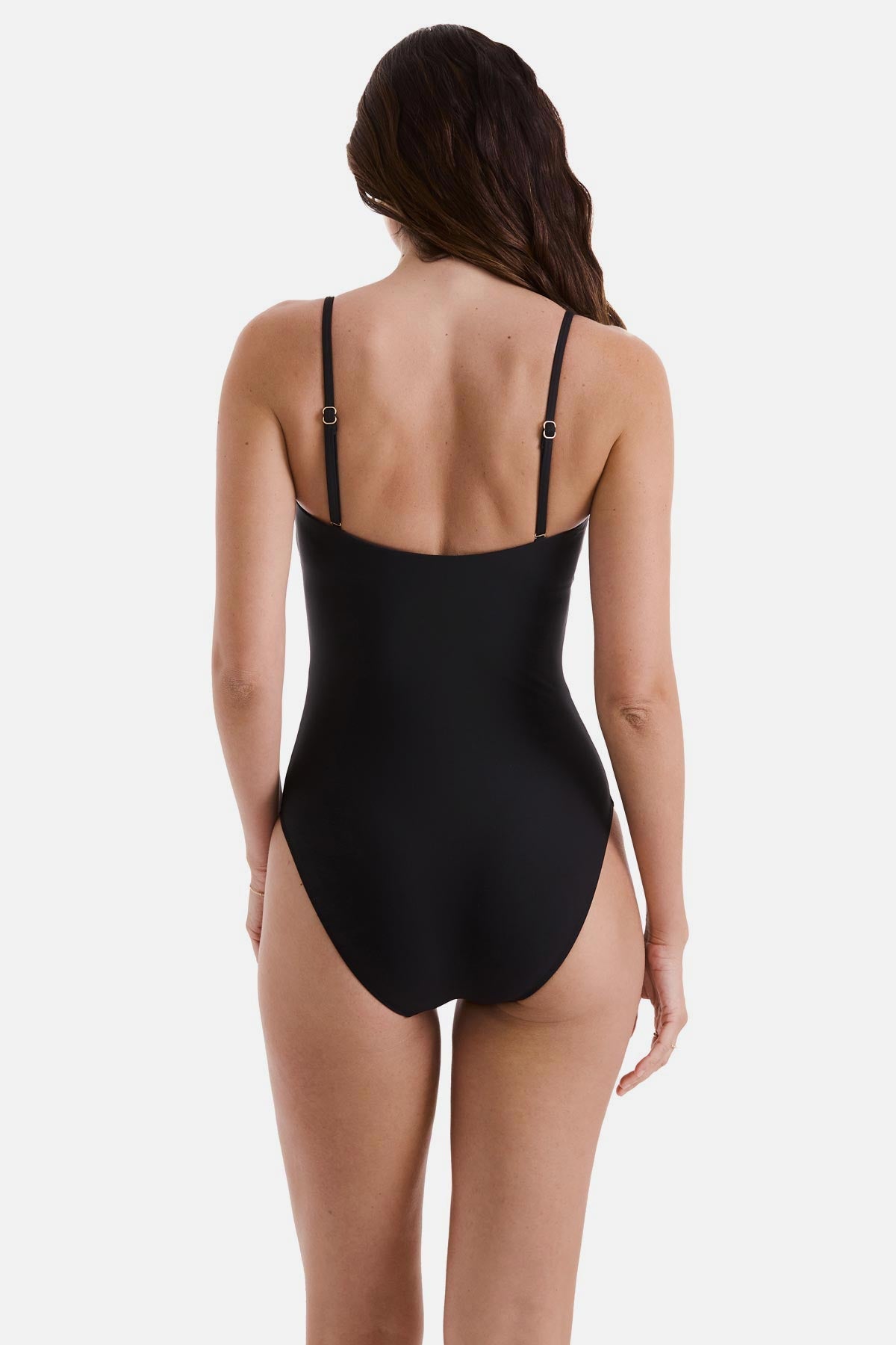 Woman wearing a black one-piece swimsuit