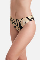 Side view of large tan and black palm leaf printed low rise swim bottoms