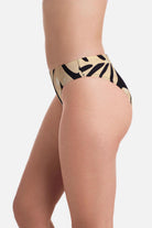Side view of large tan and black palm leaf printed low rise swim bottoms