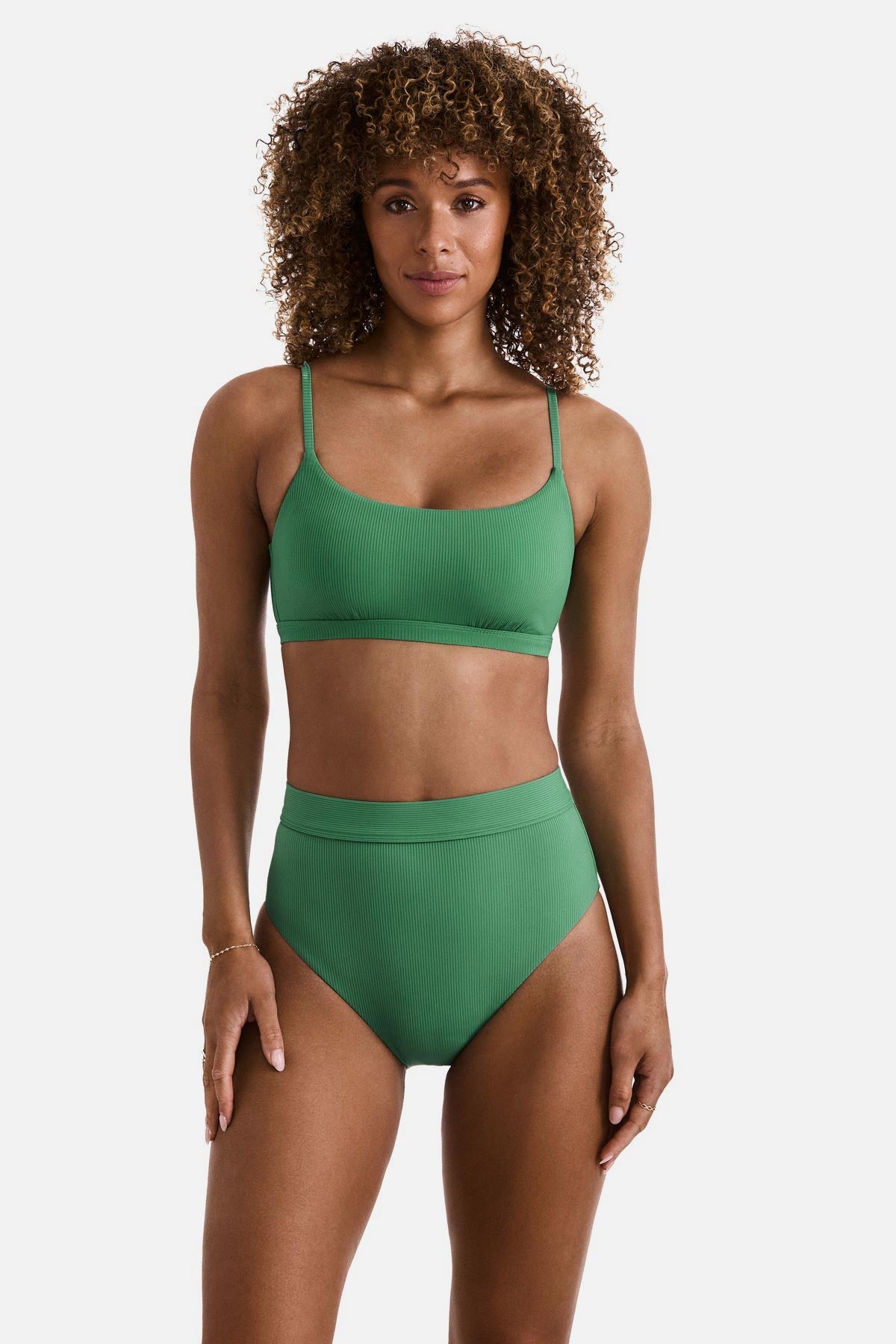 Woman wearing a green ribbed bralette swim top with matching swim bottoms