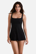 Woman wearing a black swim dress