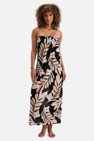 Woman wearing a black and tan palm leaf printed sleeveless swim dress cover up