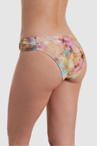 Back view of tie dye swim bottoms with side cutouts 
