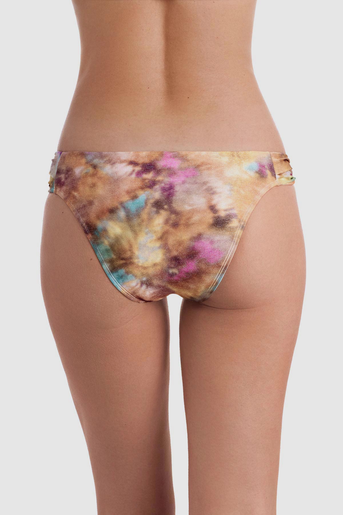 Back view of tie dye swim bottoms with side cutouts 