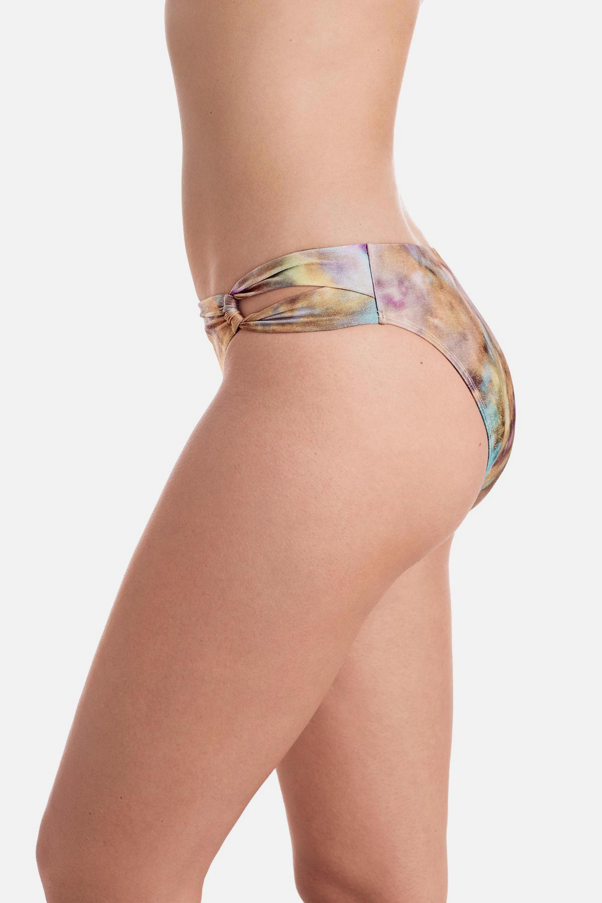 Side view of tie dye swim bottoms with side cutouts 