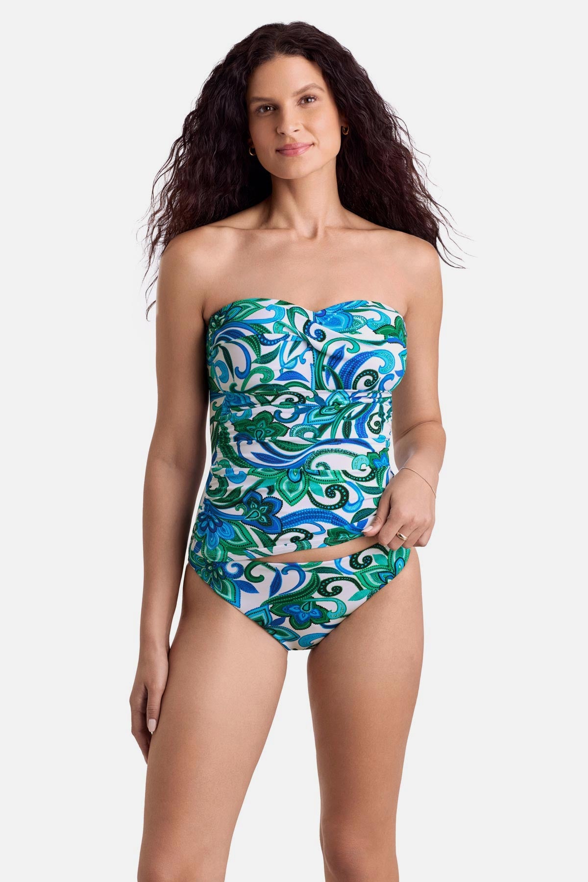 Woman wearing a blue and green floral printed bandeau tankini top