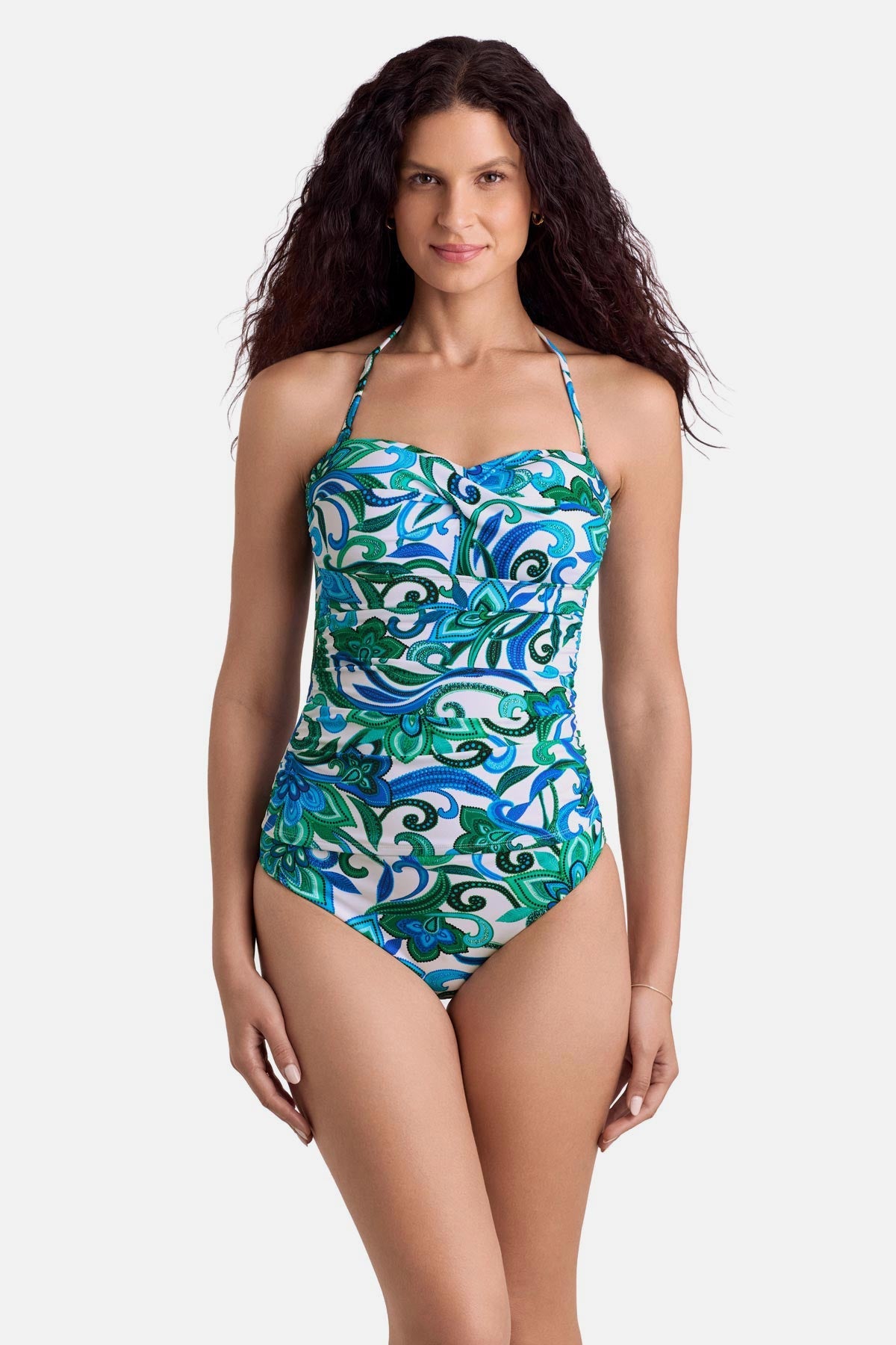 Woman wearing a blue and green floral printed bandeau tankini top